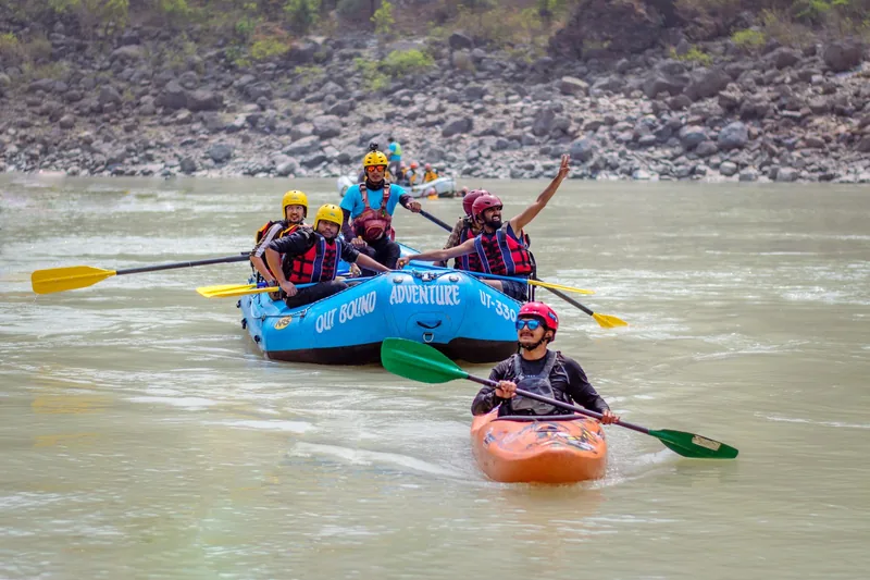 Team whitewater rafting on the river at Rishikesh