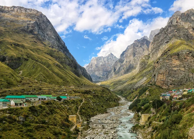 Green Himalayan valley ringed by snow peaks on the Har Ki Dun trek